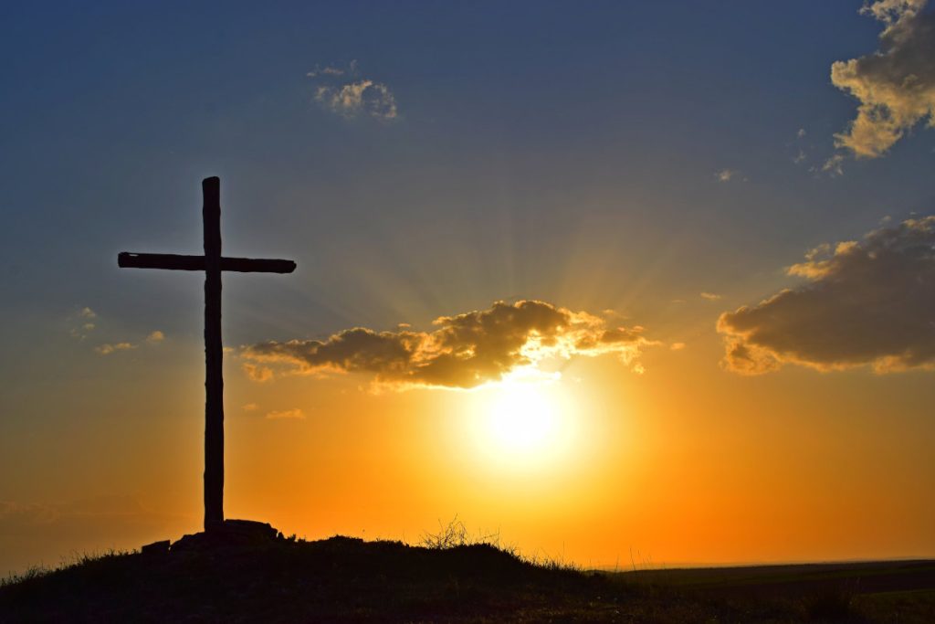 cross at sunset - celebrate Easter