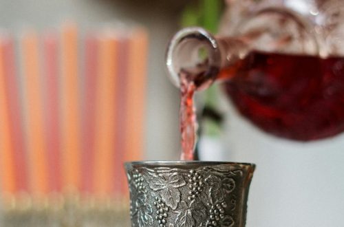 pouring wine into metal cup - abolishing Christmas