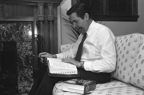 Jeffrey R. Holland studying the Bible