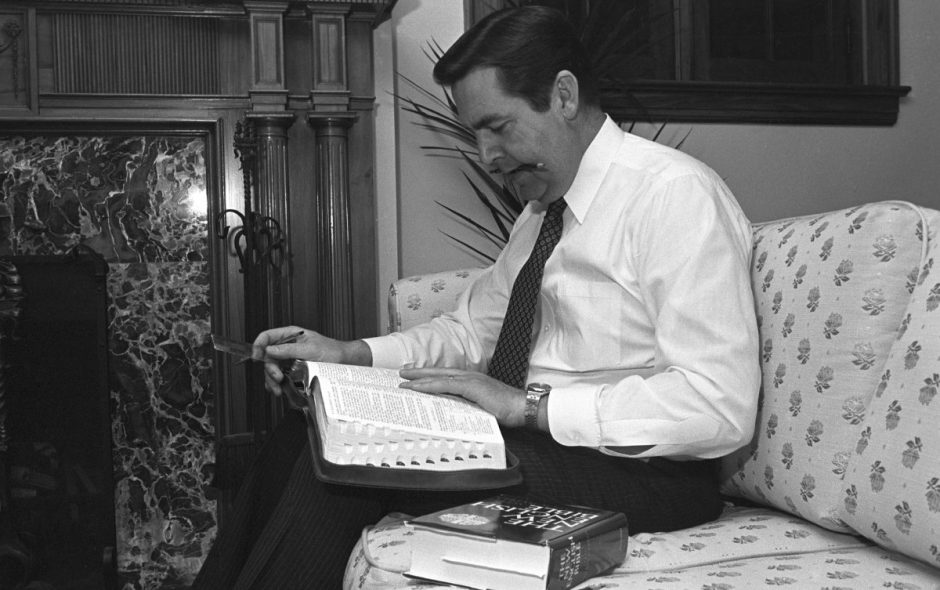 Jeffrey R. Holland studying the Bible